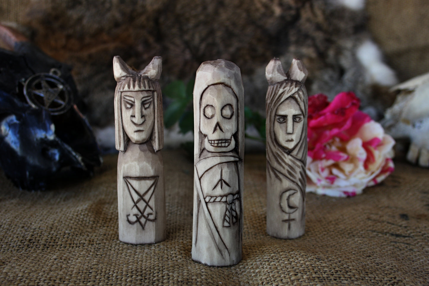 Small handcorved wooden figurines of Death Lilith and Lucifer.