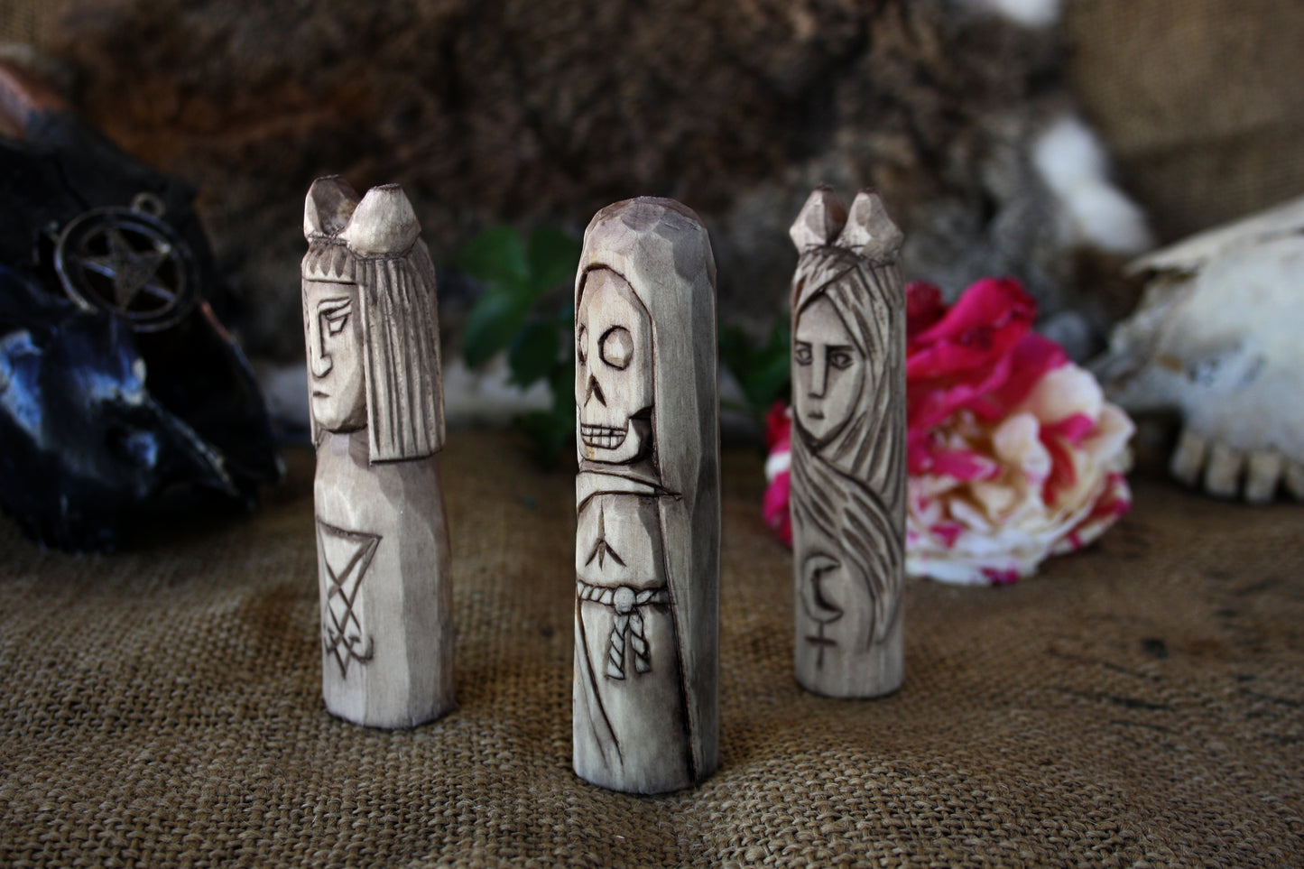 Small handcorved wooden figurines of Death Lilith and Lucifer.
