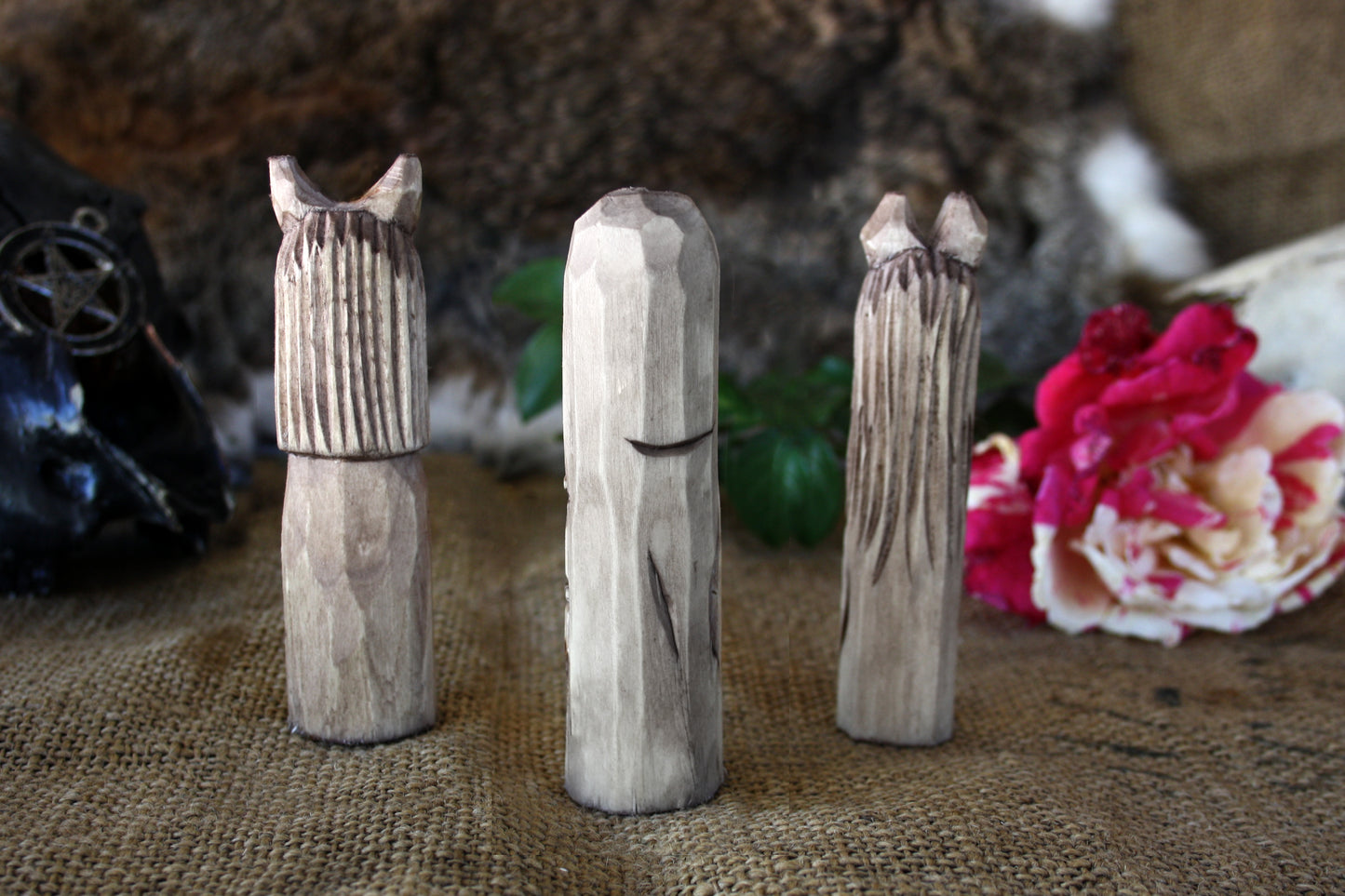 Small handcorved wooden figurines of Death Lilith and Lucifer.