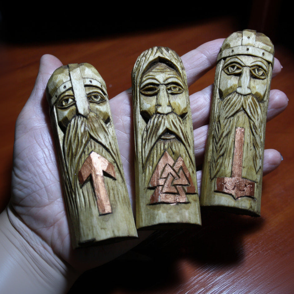 Odin Thor Tyr Wooden Wall Plaque Set held in a hand