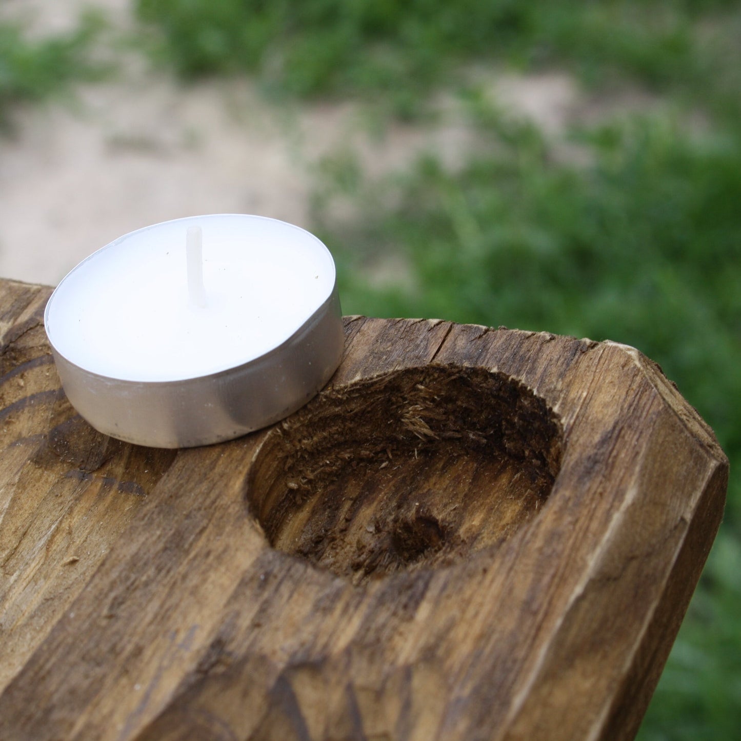 White candle on a Hand carved wooden Norse altar for Viking pagan setup