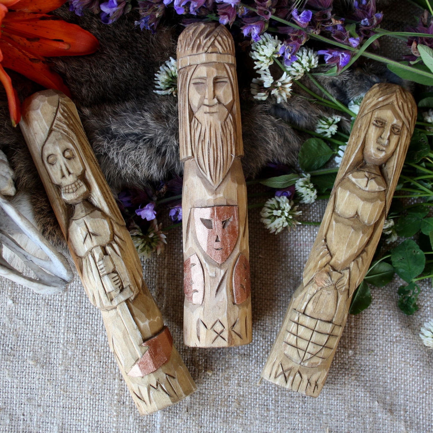 TLoki wooden statue 18 cm hand carved figurine with other Norse godson a textured surface with flowers and fur.