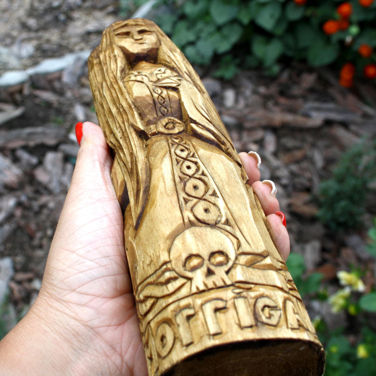 Big wooden statue of morrigan. celtic statues