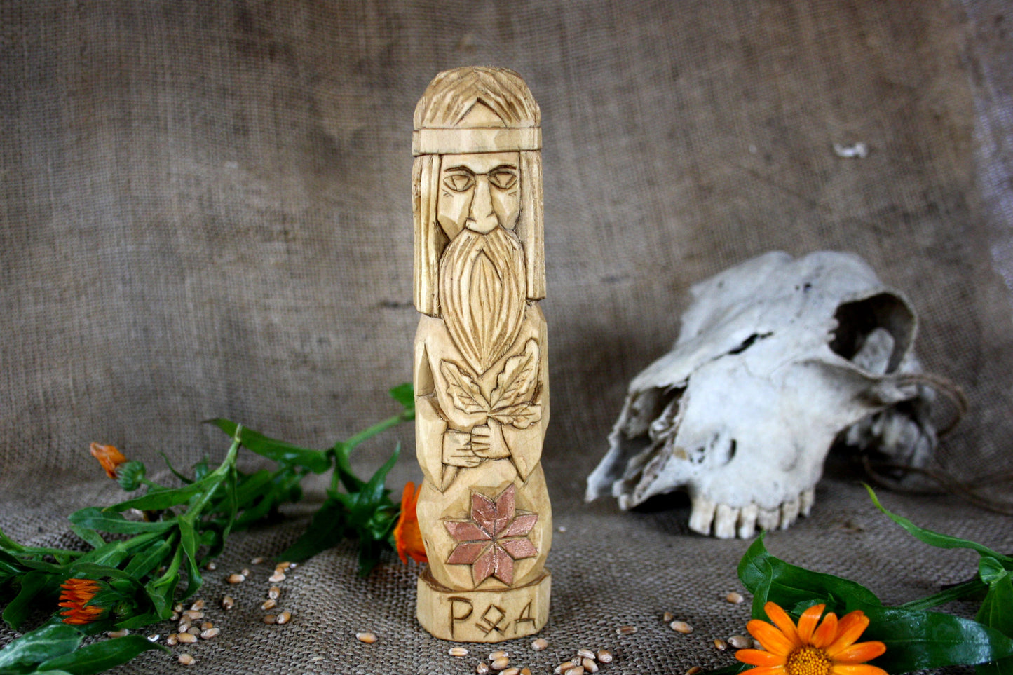Hand carved figurine of the Slavic god Rod