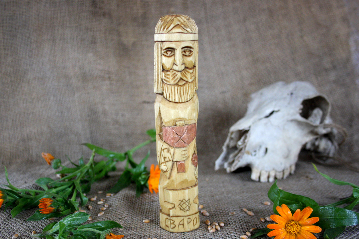 Hand carved figurine of the Slavic god Svarog
