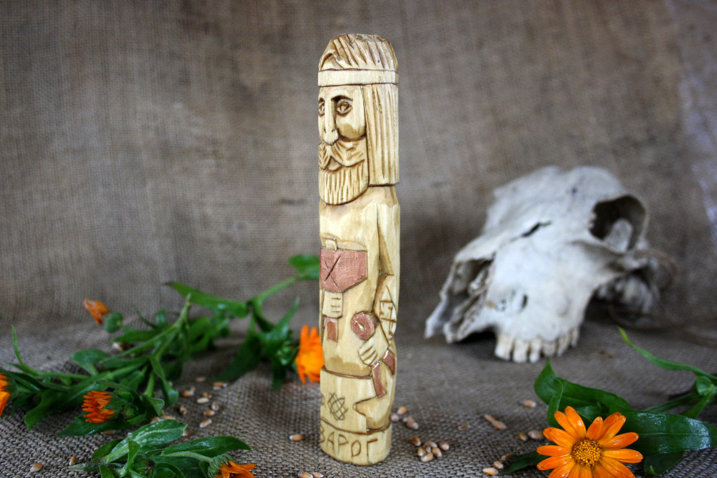 Hand carved figurine of the Slavic god Svarog