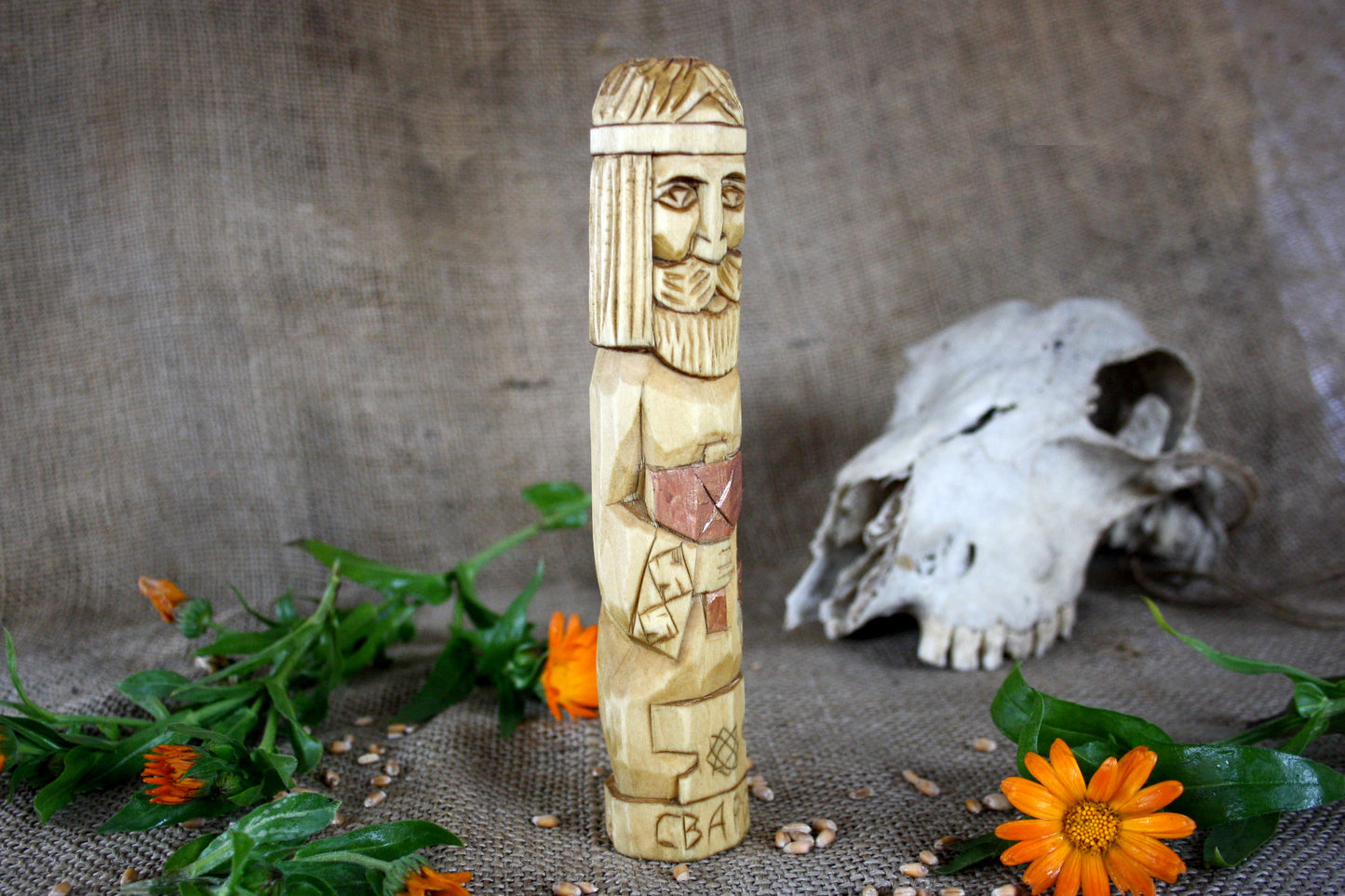 Hand carved figurine of the Slavic god Svarog