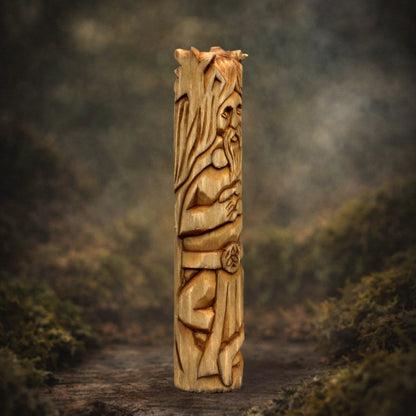 Side view of wooden Cernunnos figurine showing carving texture