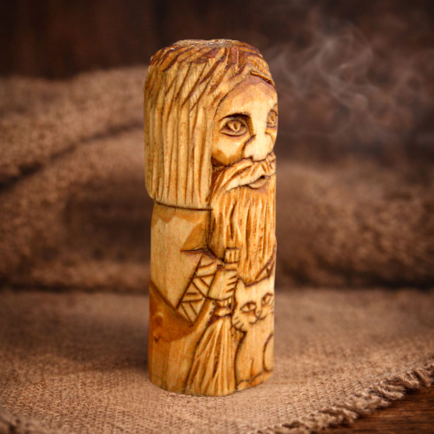 Handmade Domovoy figurine on natural fabric background