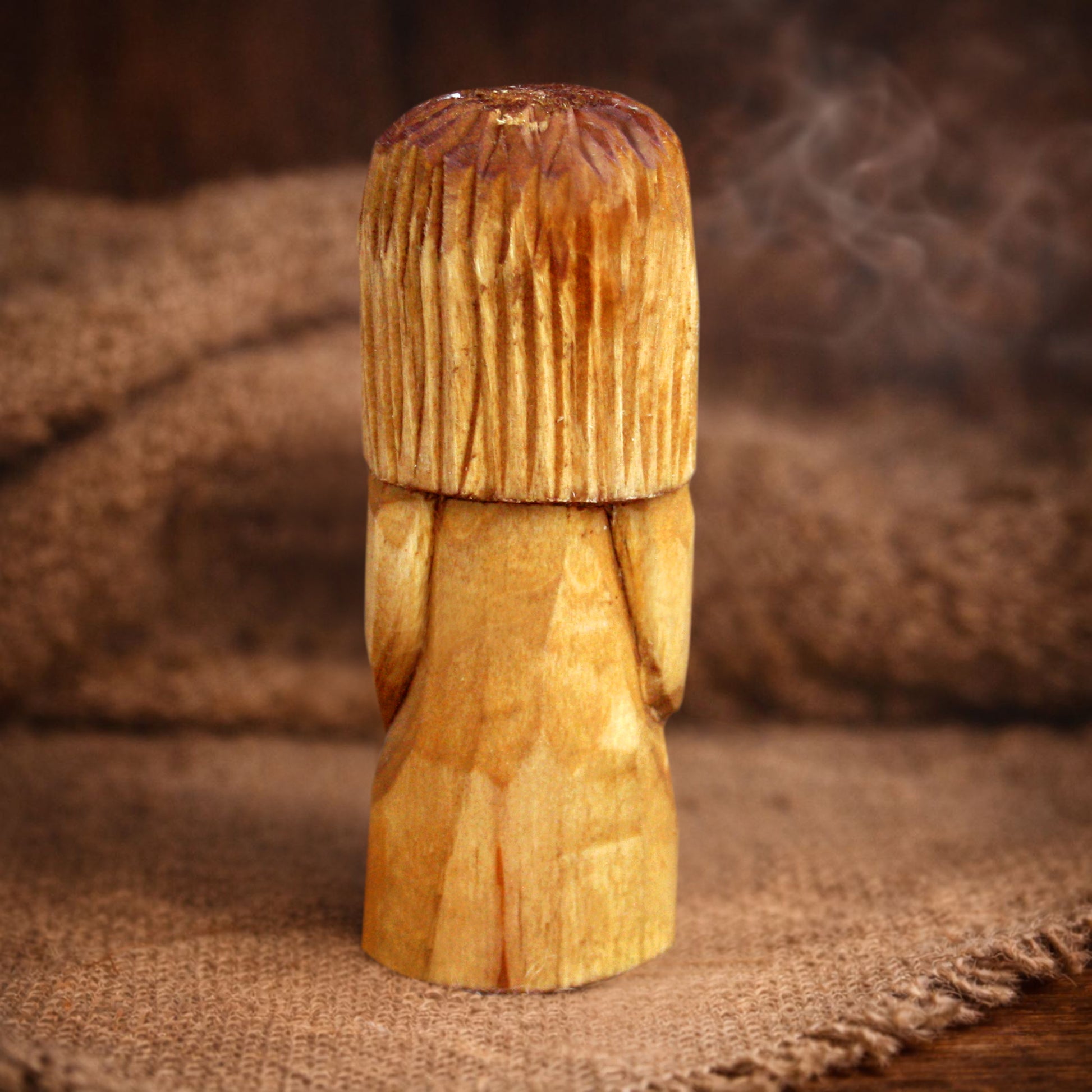 Side view of Slavic Domovoy wooden folk statue