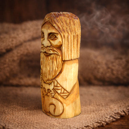 Side view of Slavic Domovoy wooden folk statue