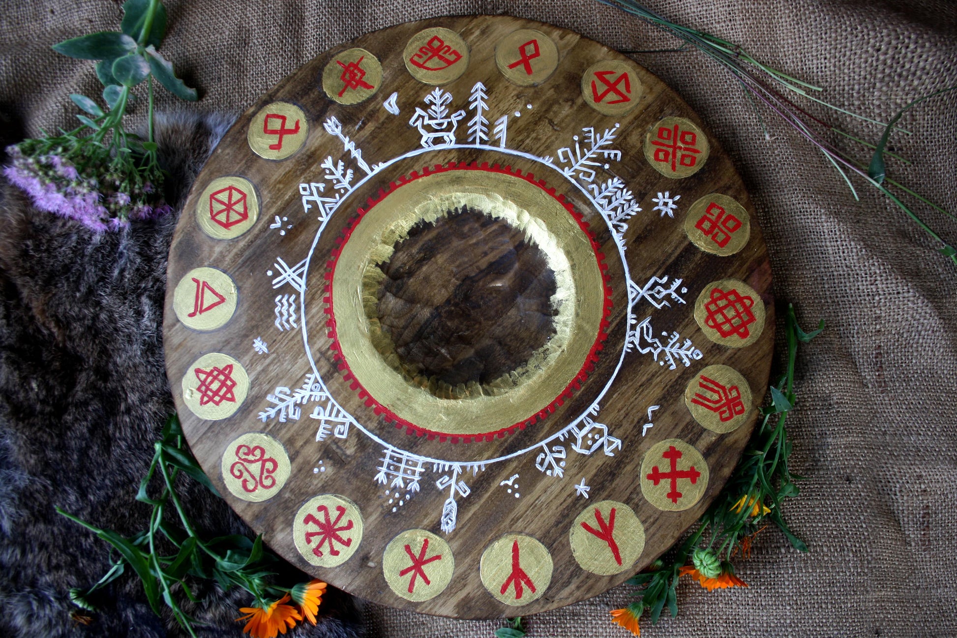 Round altar for the gods with runes