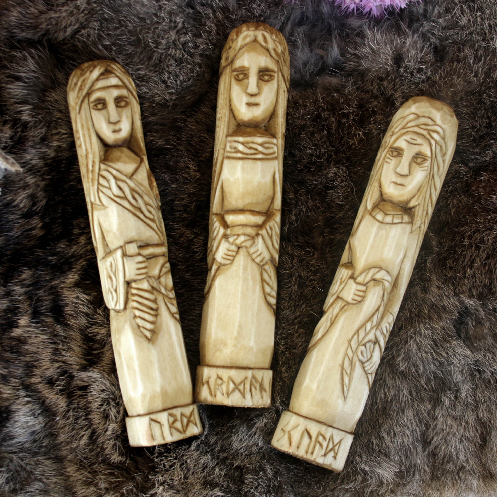Norse Norns wooden statue set 15 cm Urd Verdandi Skuld on a textured dark surface