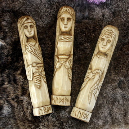 Norse Norns wooden statue set 15 cm Urd Verdandi Skuld on a textured dark surface