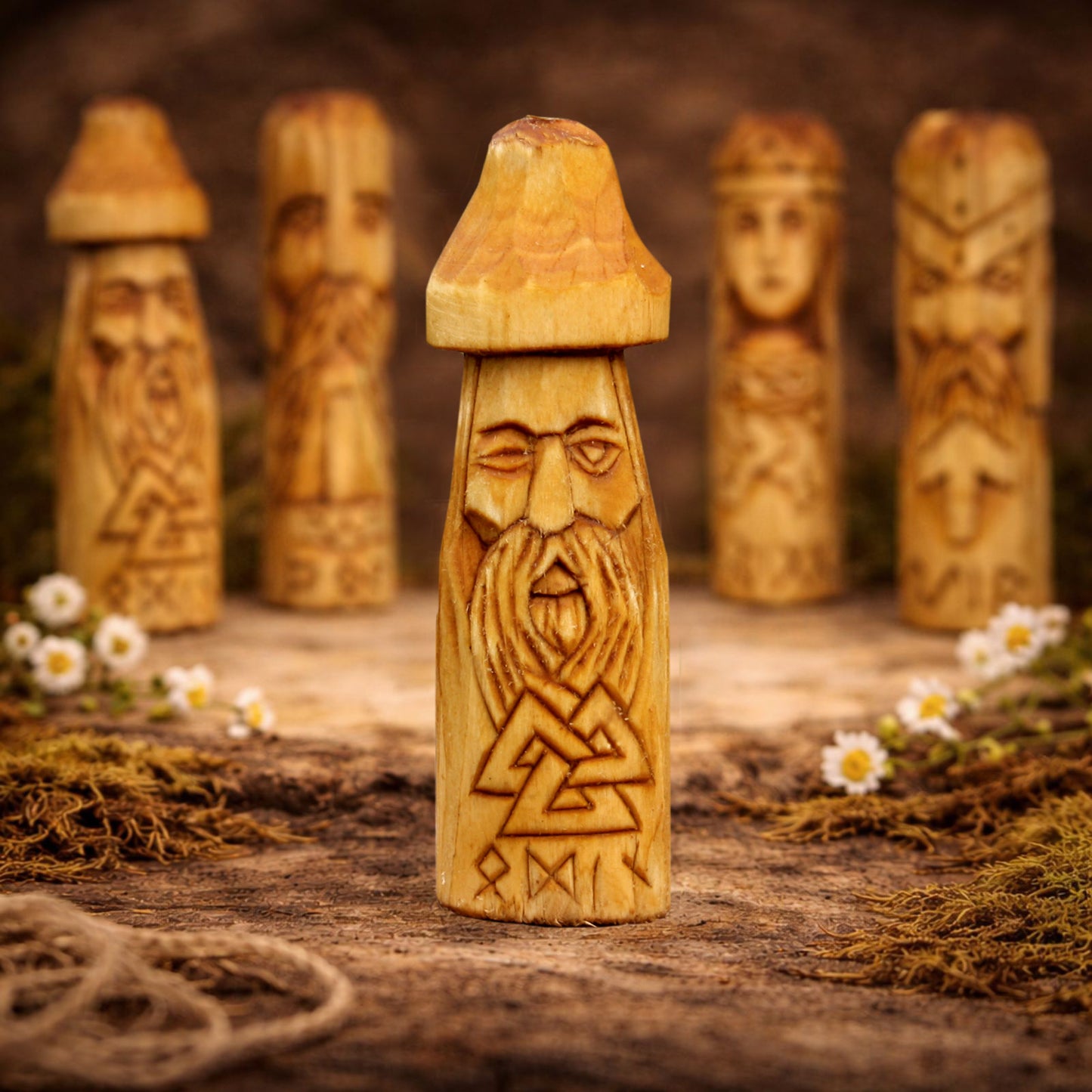 Wooden figurine Odin with carvings on a rustic background