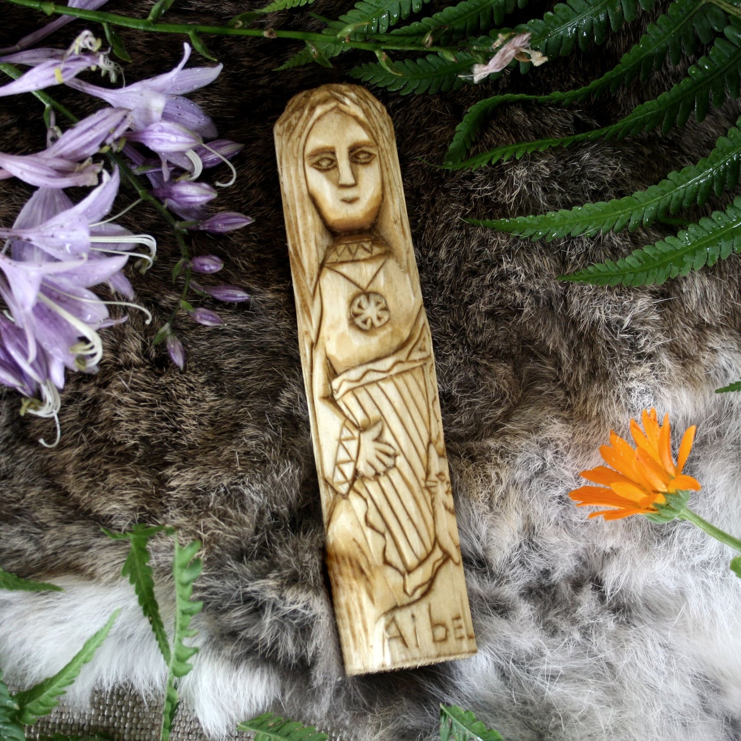 
Aibell Celtic goddess 15cm hand-carved wooden statue in natural setting