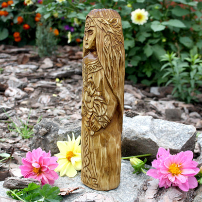 Side detail of the Áine Celtic goddess statue with flowing hair and carved ornaments