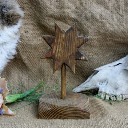 Back view of handcrafted wooden Alatyr symbol made from linden wood