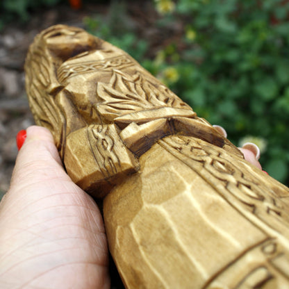 Close-up of the decorative carving on the Brigid wooden goddess sculpture
