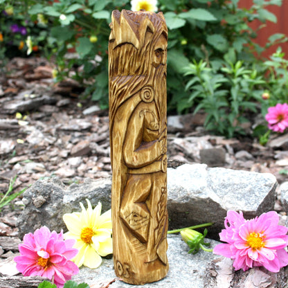 Side view of the Cernunnos sculpture showing carved wooden ornaments