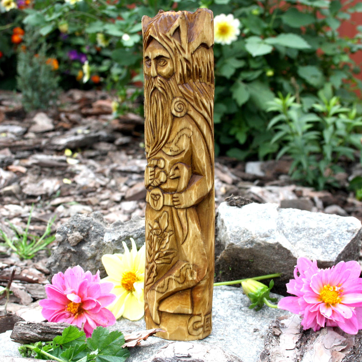 Side detail of the hand-carved Cernunnos statue showing its textured ornaments