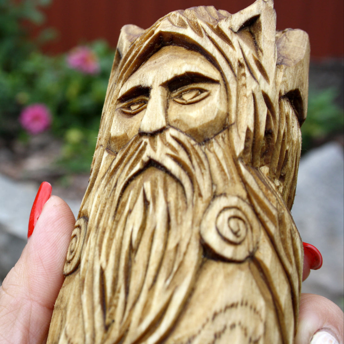 Close-up of Cernunnos with a detailed wooden face, beard, and horns