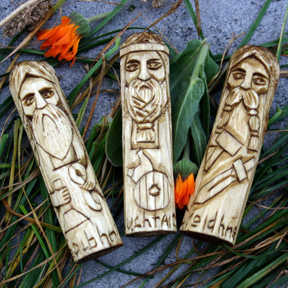 Wooden figurines of Creidhne, Luchtaine and Goibhniu from the Celtic mythology collection