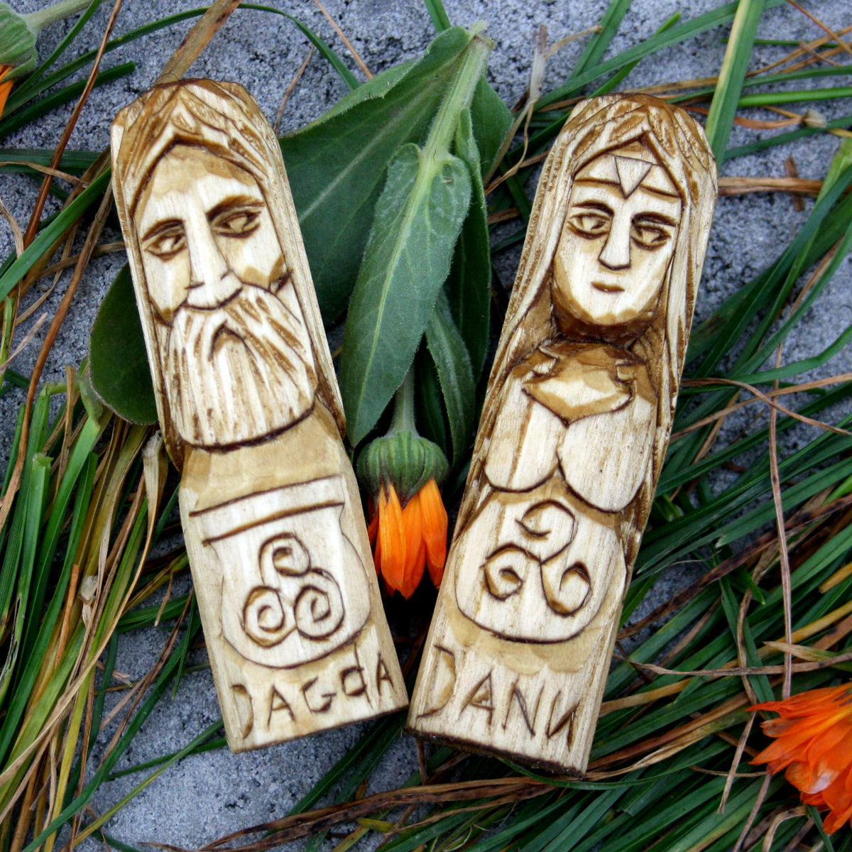 Hand-carved wooden figures of Dagda and Danu from the complete Celtic pantheon set