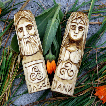Hand-carved wooden figures of Dagda and Danu from the complete Celtic pantheon set