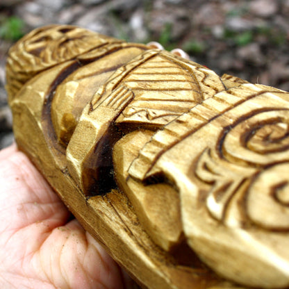 Close-up of the spiral ornament carved into the base of the Dagda wooden statue