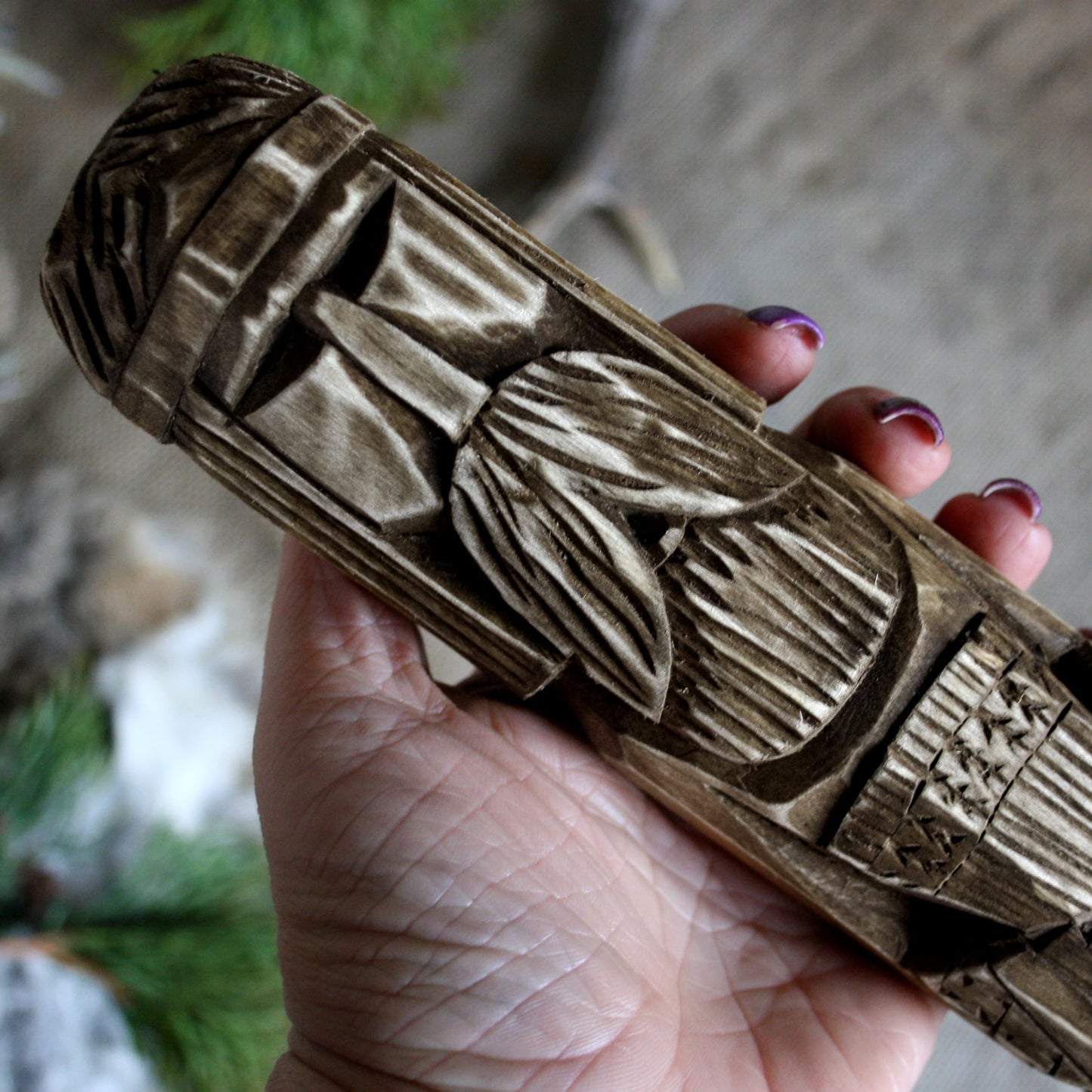 Close-up of Dazhbog Slavic god of the sun wooden idol 25 cm showing hand-carved facial details