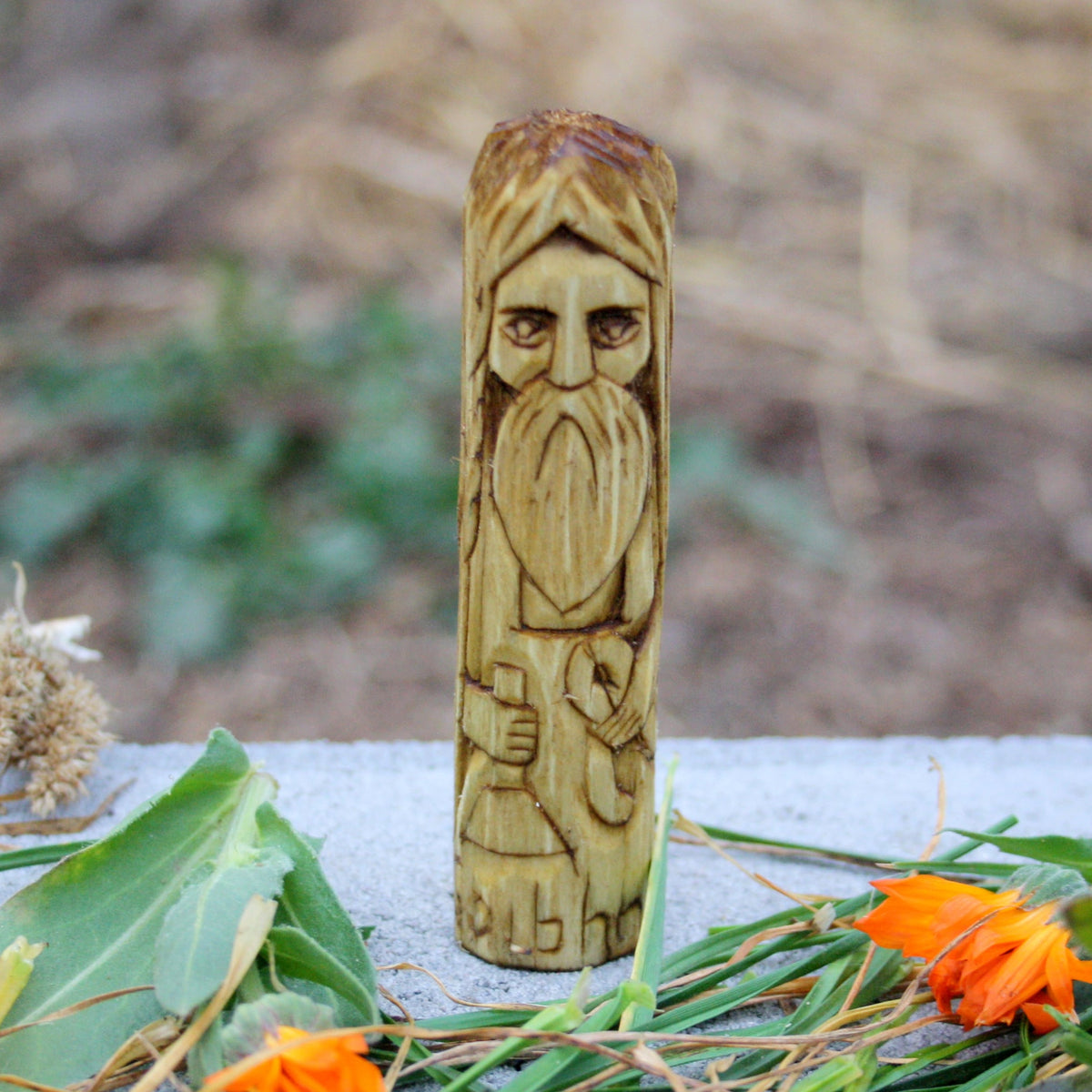 Hand-carved wooden Goibhniu figurine representing the smith of Irish mythology