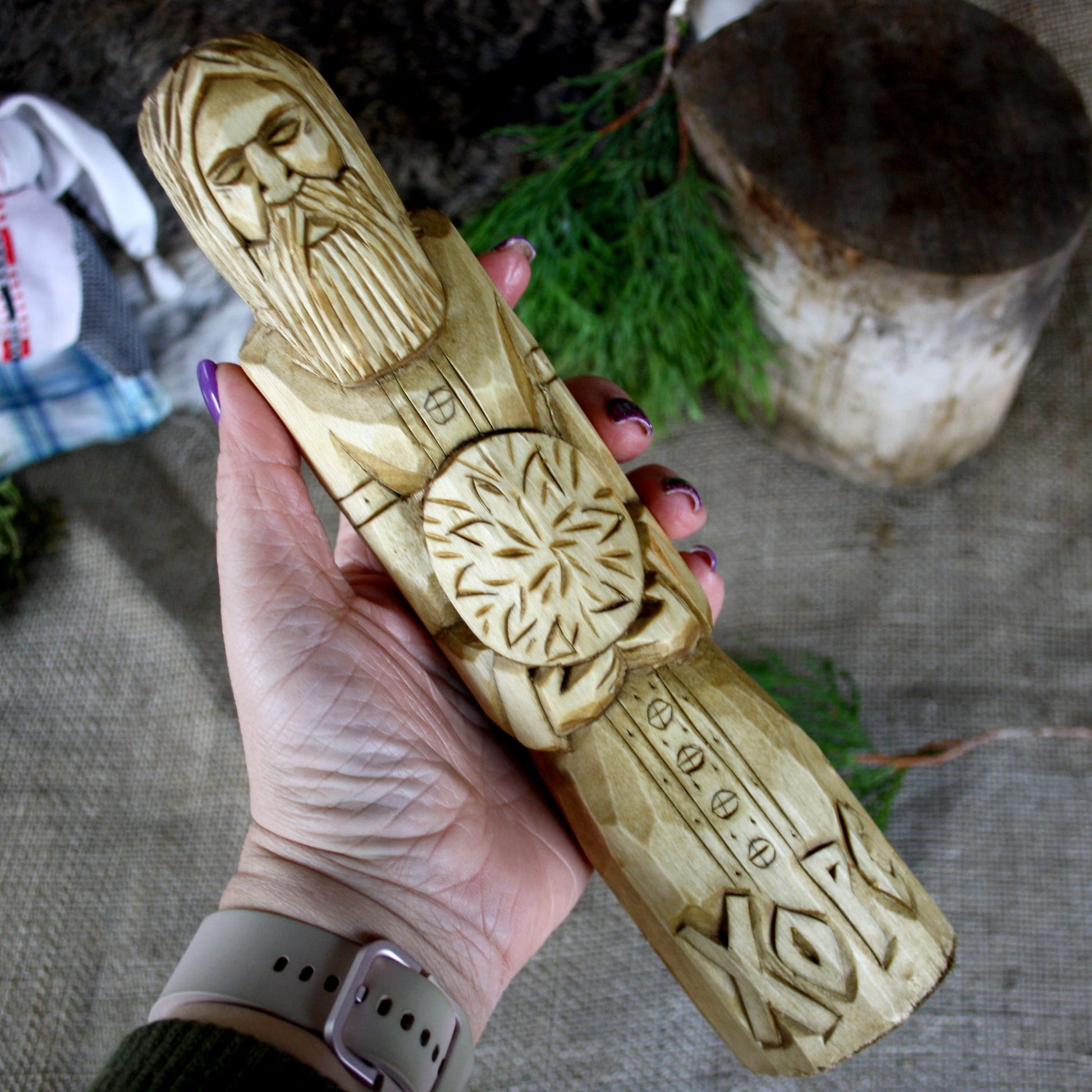 Khors Slavic God wooden statue held in hand for size comparison