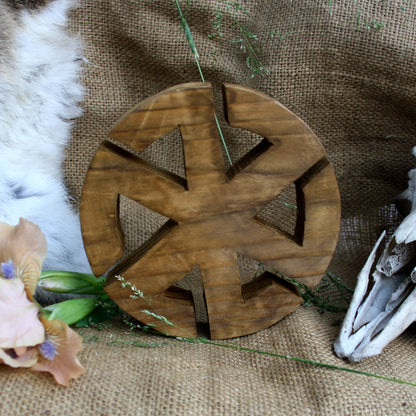 Back side of handcrafted wooden Kolovrat symbol made from natural linden wood