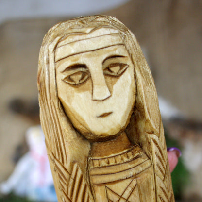 Close-up of Lada Slavic Goddess face hand carved wooden statue