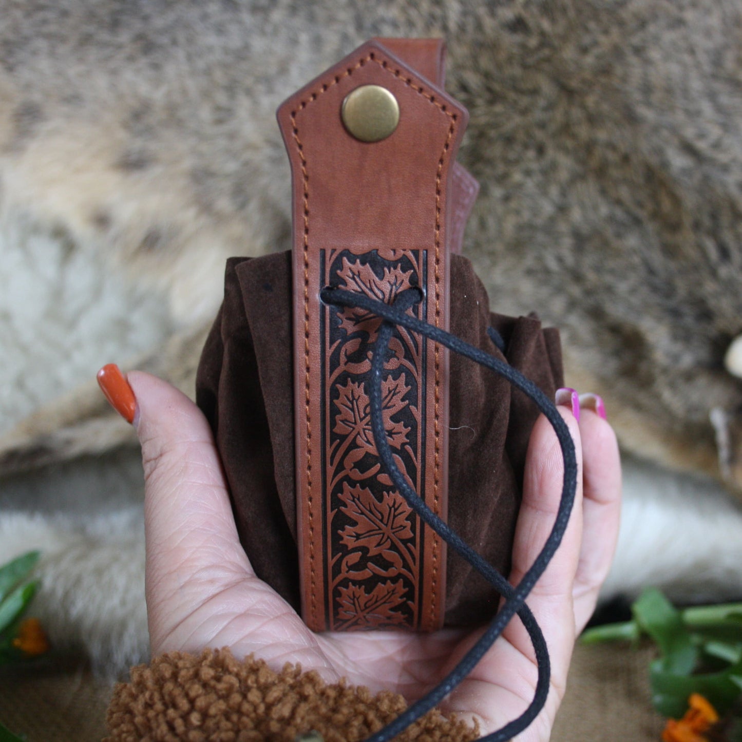 Leather pouch for slavic set of runes in hand