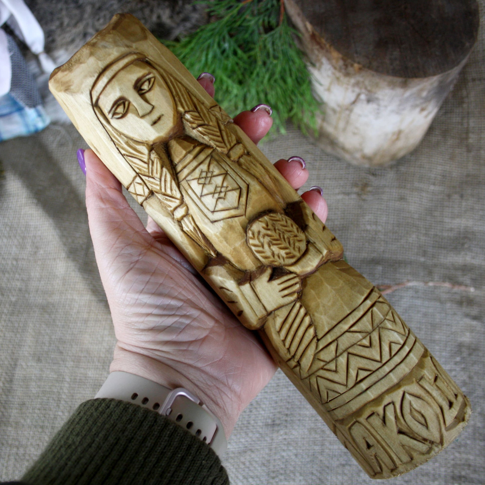 Makosh Slavic Goddess wooden statue held in hand for size comparison