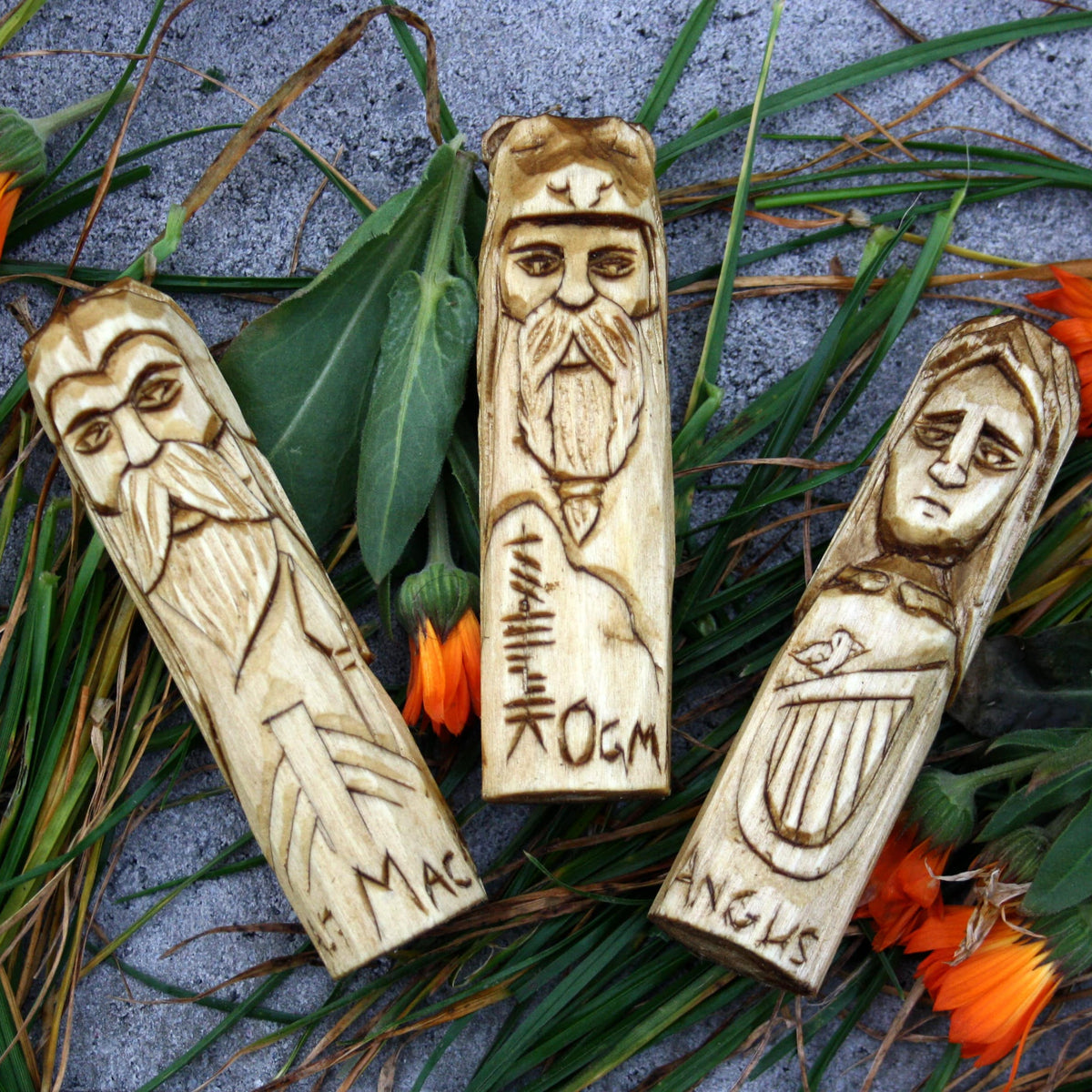 Three hand-carved 10 cm wooden Celtic figures of Manannan mac Lir, Angus and Ogma