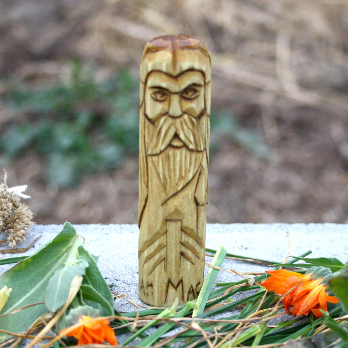 Small wooden Manannan mac Lir figurine representing the Irish mythological figure associated with the sea