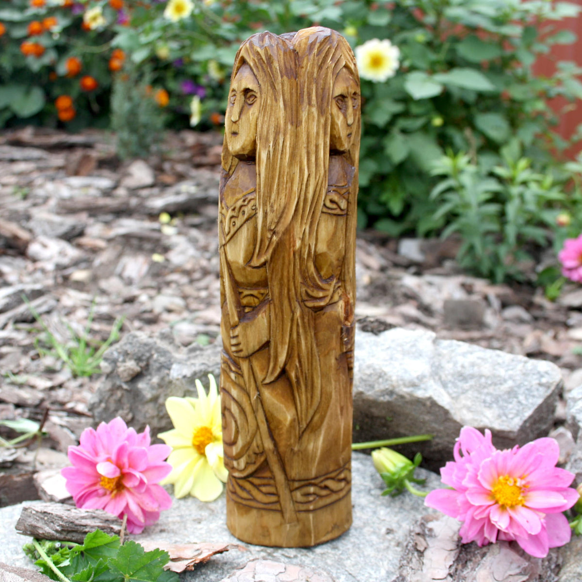 Side view of handmade Morrigan statue carved from natural linden wood