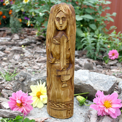Wooden Celtic Morrigan idol showing one of three carved female figures