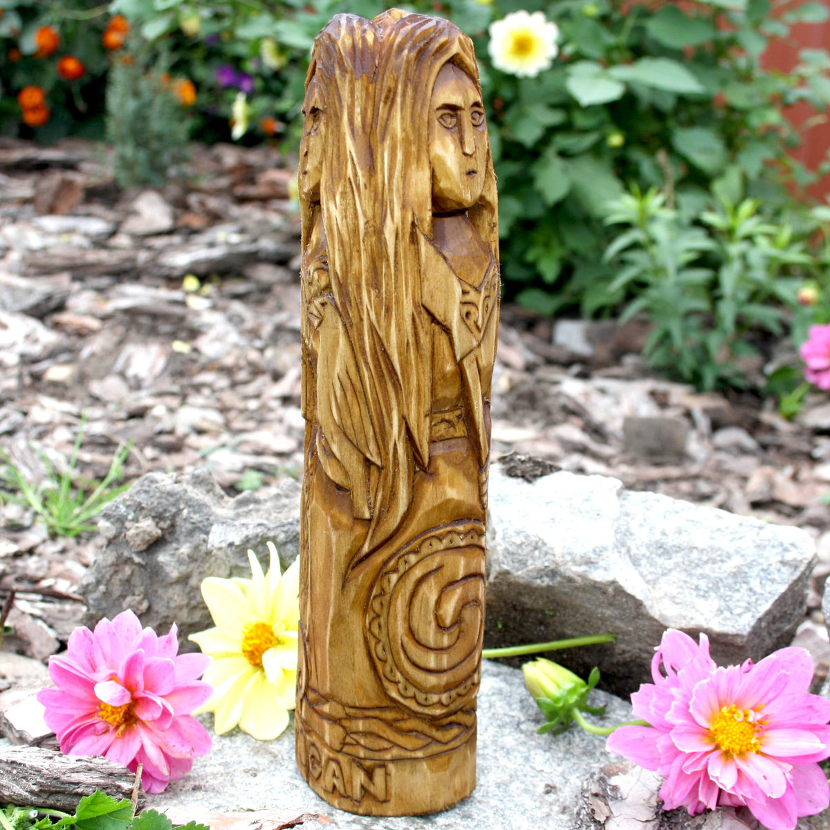 Triple-form Morrigan wooden statue showing long carved hair and side details