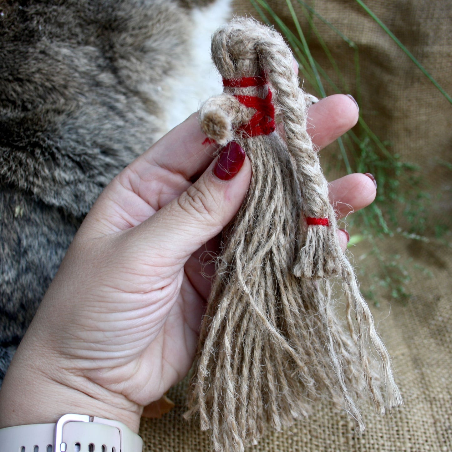 Back of Ukrainian Motanka Doll held in hand