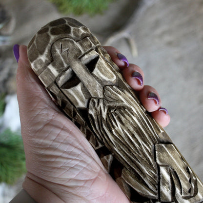 Close-up of Perun Slavic god of thunder wooden idol 25 cm showing hand-carved facial details