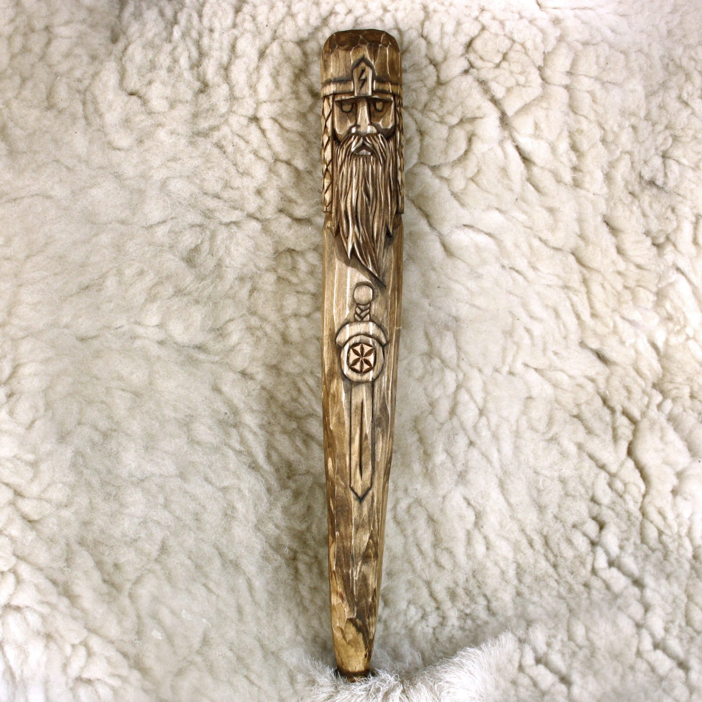 Front view of handmade Perun wooden ritual staff