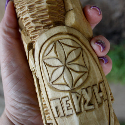 Detailed carving of Perun Slavic God wooden statue