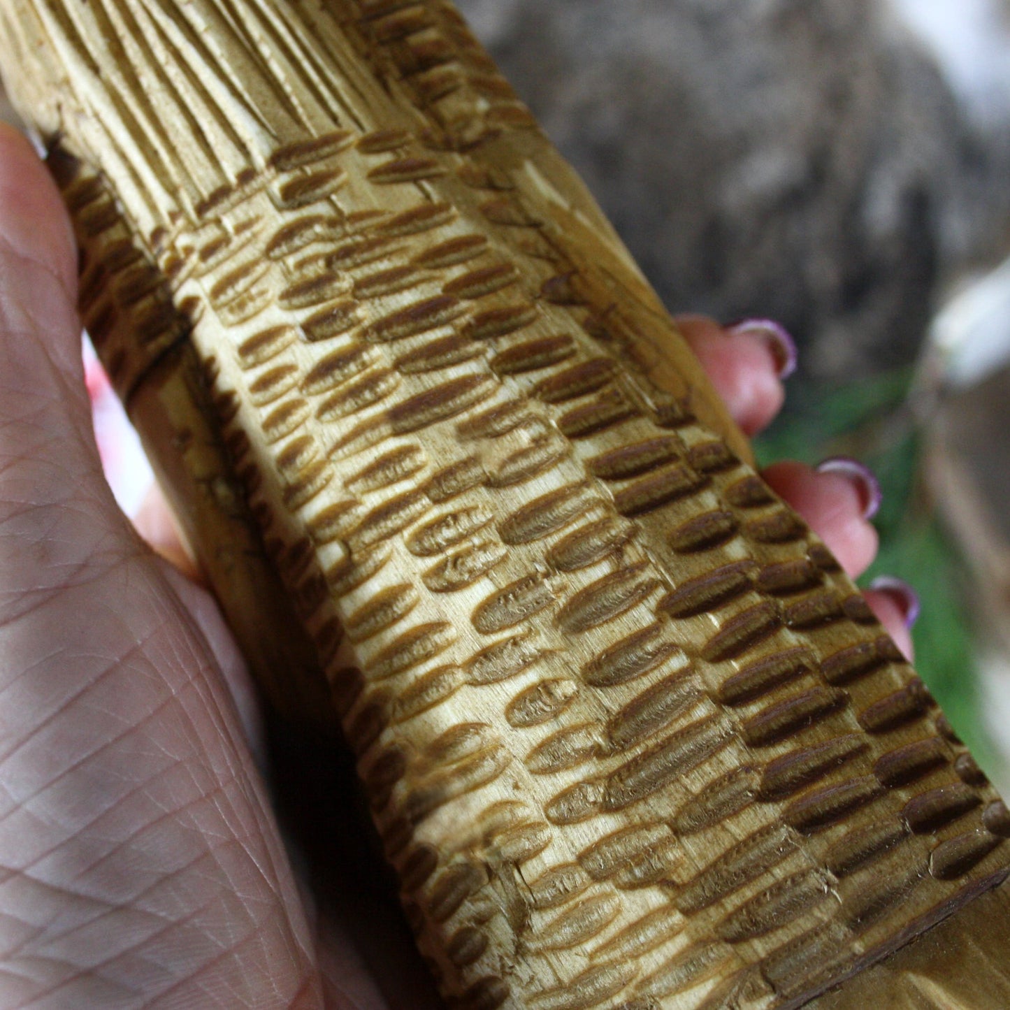 Close-up of natural wood grain on Perun Slavic God statue