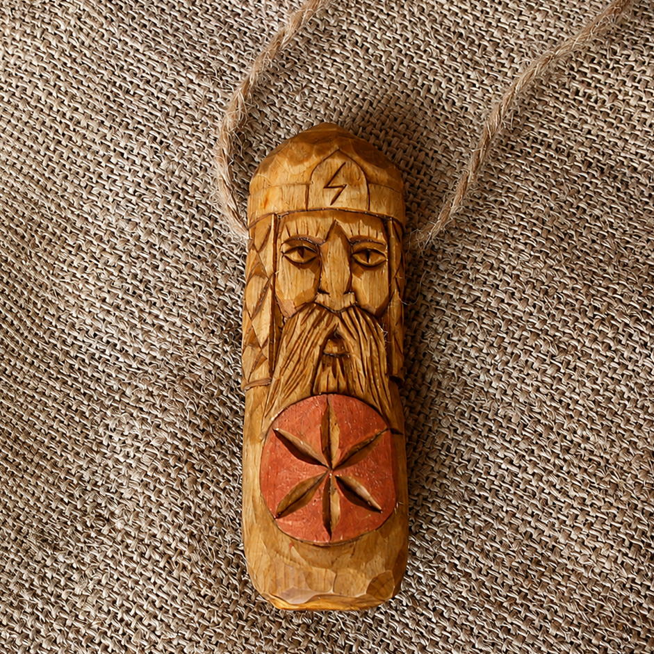 Front view of handcrafted Perun wooden pendant