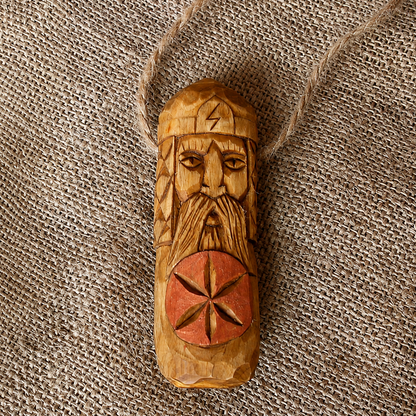 Front view of handcrafted Perun wooden pendant