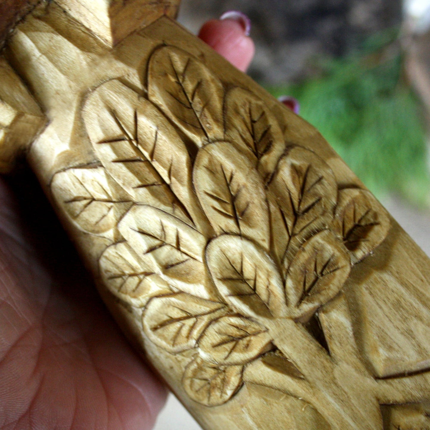 Close-up of natural wood grain on Rod Slavic God hand carved statue